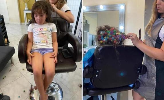 Маленькая девочка запутала в своих волосах мелкие игрушки. Но парикмахер справилась - новая стрижка идет девочке еще больше